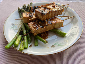 fingers of firm tofu coated in satay sauce and grilled. Yum.